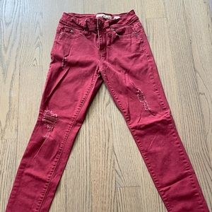 Size 3. Red jeans with rips